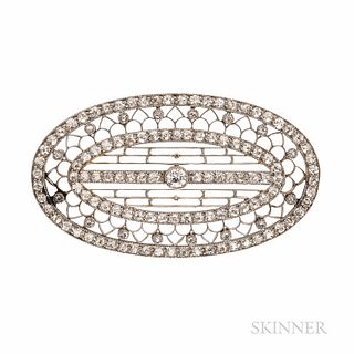Edwardian Platinum and Diamond Brooch, set with one old European-cut diamond, and single-cut diamond melee, in a finely pierced mount,