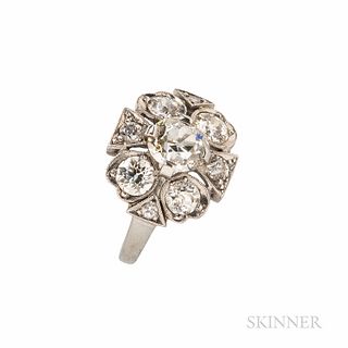 Platinum and Diamond Cluster Ring, set with an old European-cut diamond weighing approx. 0.90 cts., framed by old European-cut diamonds