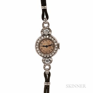 Art Deco Tiffany & Co. Platinum and Diamond Wristwatch, the silvertone dial with arabic numeral indicators, bezel and lugs bead- and be