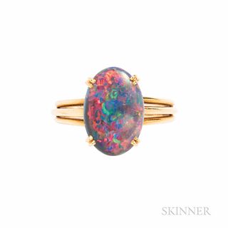 Cartier 18kt Gold and Black Opal Ring, set with an oval cabochon measuring approx. 13.50 x 9.20 x 3.00 mm, 2.9 dwt, size 5 1/4, numbere