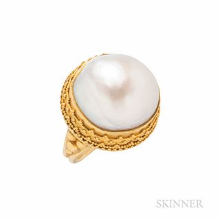 Luna Felix Gold and South Sea Pearl Ring, the round pearl in a granulated bezel, 13.1 dwt, size 6 1/2, signed.