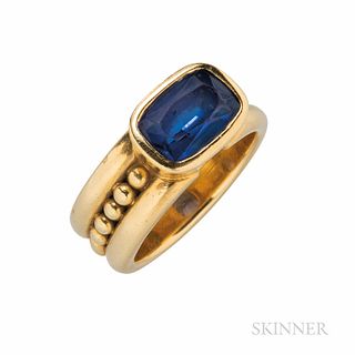 18kt Gold and Tanzanite Ring, bezel-set with a fancy-cut tanzanite, shank with bead motifs, 9.6 dwt, size 7.