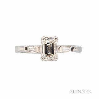 Platinum and Diamond Ring, set with an emerald-cut diamond weighing approx. 0.75 cts., size 6 1/4.