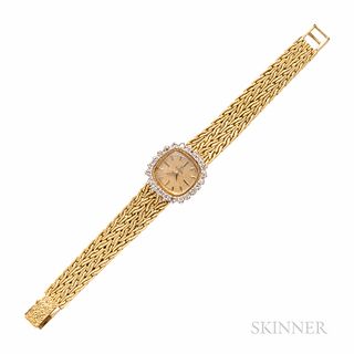 Omega Watch Co. Gold and Diamond Wristwatch, the 14kt gold case with diamond bezel, 23 x 23 mm, manual-wind movement, joined to an 18kt