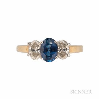14kt Gold, Platinum, Sapphire, and Diamond Ring, the oval-cut sapphire measuring approx. 7.00 x 5.10 x 3.60 mm, flanked by oval-cut dia