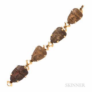14kt Gold and Stone Figure Bracelet, with four mask motifs, lg. 7 7/8, wd. 1 in.