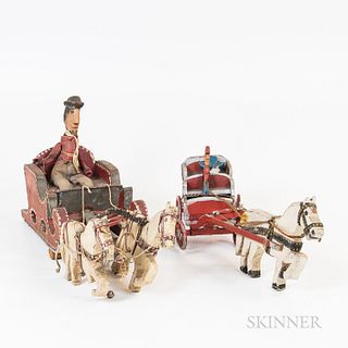Two Carved and Painted Folk Art Carvings, one of a red-painted sled with a clothed driver and white horses and a red-painted wagon pull