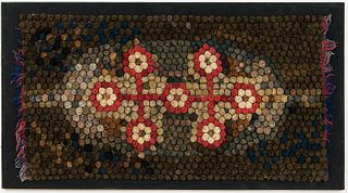 Coiled Folk Art Wool Rug, America, 19th century, the rug composed of colored coils of cloth arranged in a stylized floral pattern, ht.