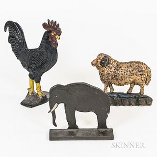 Three Painted Cast Iron Animal Doorstops, America, early 20th century, an elephant, sheep, and rooster, ht. to 12 1/2 in.Provenance: Th