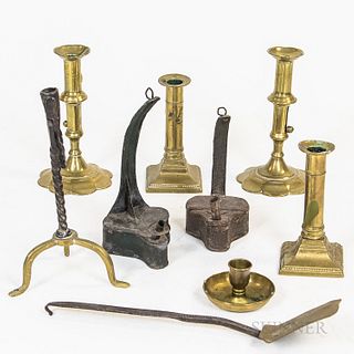 Eight Metal Lighting Devices and a Spatula, a rush light, two hanging oil lamps, two pairs of brass candlesticks, and a candlestick hol