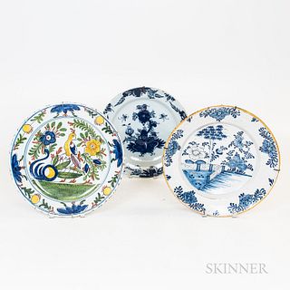 Three Continental Tin-glazed Ceramic Chargers, a polychrome and two blue and white, (imperfections), dia. to 13 1/2 in.