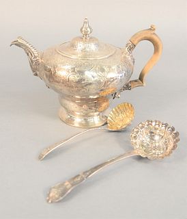 Three piece lot Georgian silver, teapot with wood handle and foliate spout along with two strainer spoons, probably 18th C., 23.8 t.oz, 6-1/2" highest
