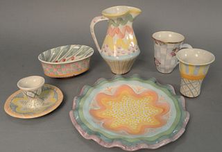 Large group of approximately twenty-eight Mackenzie Childs tableware to include six coffee cups, five scalloped edge plates, one egg cup, one large pi
