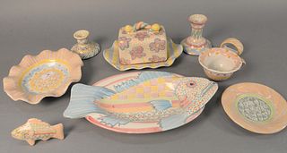 Large group of approximately thirty-six Mackenzie Childs tableware to include three fish platters, six napkin rings, butter plate with cover, large se