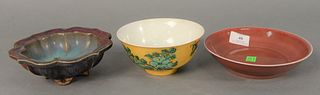 Group of three Chinese porcelain bowls to include Junyao stoneware footed bowl with lotus form with turquoise and purple glaze, dia. 6 1/2"; red glaze