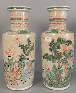 Pair of Chinese Famille verte Wucai porcelain vases, painted with scrolling pine tree and figures on horseback, ht. 18 1/2".