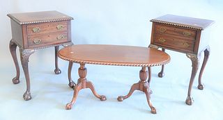 Potthast four piece mahogany  set, oval coffee table with carved rope edge on ball and claw feet along with a pair of two drawer end tables on ball an