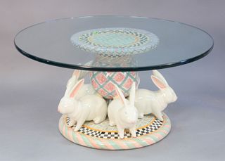 Two piece lot, to include, Mackenzie Childs coffee table, hand painted ceramic pottery featuring rose cottage floral pattern and white rabbits around 