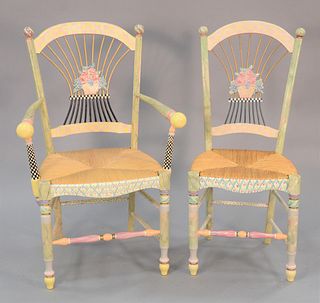Five hand painted Mackenzie Childs Light Flower Basket chairs with ceramic floral decorations and ratan seats, one arm chair and four side chairs. 40"