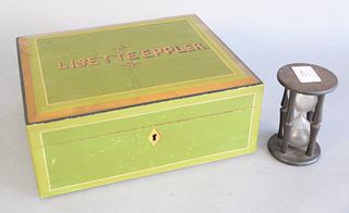Two piece group to include a green painted box marked 'Lisette Eppler', fitted interior and small early turned wood and blown glass hourglass, ht. 4-1