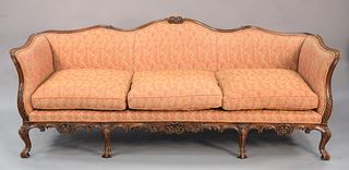 Two piece group to include French-style custom sofa, three cushions, with carved apron and cabriole legs 31" x 92 1/2" x 29 1/2", along with a coffee 