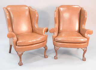 Pair of Kindel Winterthur Collection brown leather Chippendale style wing chairs, ball and claw feet. 44" x 39" x 20-1/2".