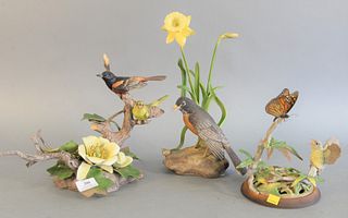Group of three Boehm porcelain birds, "Orchard Oriole", "Robin with Daffodils", and "Fledging Canada Warbler", each stamped to the underside, hts. 9 1