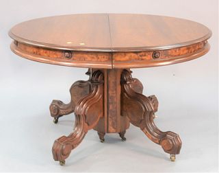 Victorian round walnut table, carved pedestal base, four leaves, ht. 30", dia. 47".