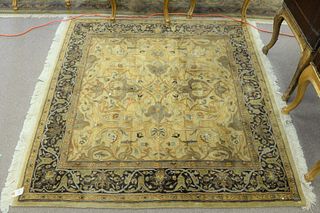 Square Oriental rug, tan and green, 5' x 5'.