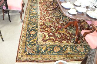 Room size oriental carpet, green and reds, 9' x 12'.
