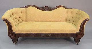 Victorian sofa having empire influenced carved mahogany frame, tufted upholstered back, ht. 28", wd. 83", dp. 23".