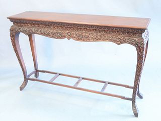 Oriental hall table, heavy carved flower apron, ht. 39", top 60" x 15". Provenance: Estate of Mark W. Izard MD, Cider Brook Road, Avon, Connecticut.