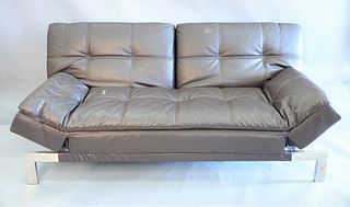 Contemporary brown leather folding sofa, folds down into bed on chrome legs, ht. 38" x wd. 80" x dp. 37".