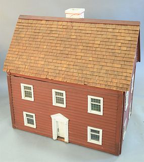 Large red colonial-style dollhouse, containing doll furniture, 41" x 40 1/2" x 27". Provenance: The Vincent Family Collection, Fairfield, Connecticut.