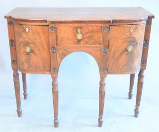 George III diminutive mahogany sideboard, central drawer flanked by bottle drawer and door, circa 1810, restored, ht. 35", wd. 43-1/2", dp. 21".