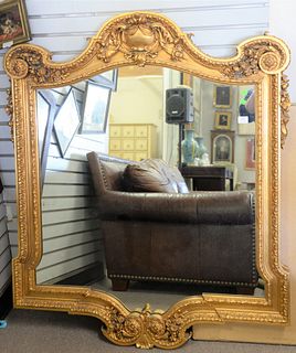 Large contemporary gold framed mirror, carved flowers, 55" x 45".