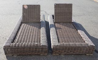 Pair of Rattan outdoor chaise lounges.