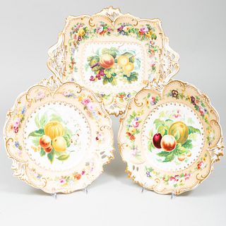 Three English Cream Ground Porcelain Compotes Decorated with Fruit