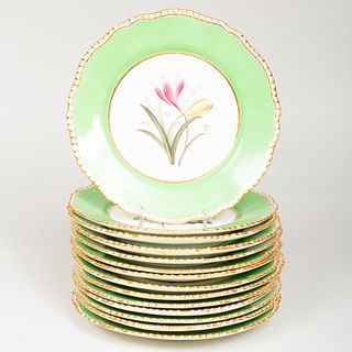 Set of Fourteen English Green Ground Porcelain Dessert Plates Decorated with Flowers