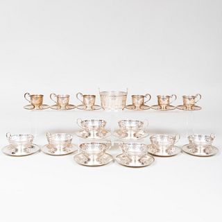 Group of Silver Cups and Saucers and a Sugar Basket with a Glass Liner