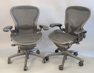 Pair of Herman Miller executive office armchairs on swivel bases, adjustable ht. 38 1/2".