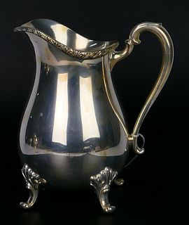 LARGE INTERNATIONAL SILVER FOOTED WATER PITCHER
