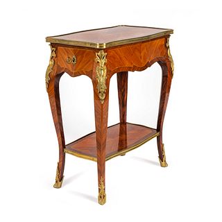 A Louis XV Style Gilt-Bronze-Mounted Kingwood and Tulipwood Table en Chiffoniere
Height 28 1/4 x width 23 x depth 13 inches.