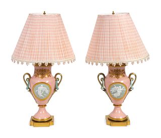 A Pair of Continental Porcelain Vases Mounted as Lamps
Height excluding fittings 14 1/2 x width 10 1/2 inches.