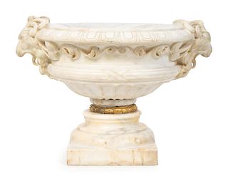 A Neoclassical Style Carved Marble Urn
Height 15 x length over handles 21 inches.