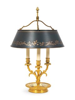 A Louis XVI Style Gilt-Bronze Bouilotte Lamp
Height 24 x diameter of shade 15 inches.