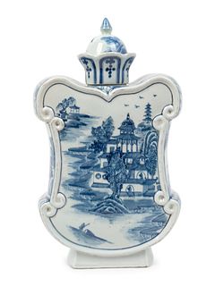 A Chinese Blue and White Porcelain Cartouche-Shaped Bottle Vase
Height 16 1/2 x width 9 1/2 x depth 4 inches.