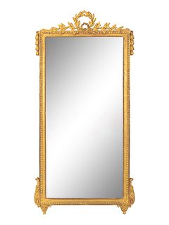 A Louis XVI Giltwood Mirror
Height 63 x width 33 inches.