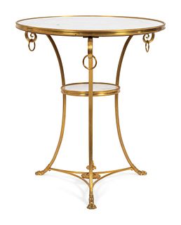 A Directoire Style Gilt-Bronze and Marble Gueridon
Height 27 1/2 x diameter 24 inches.
