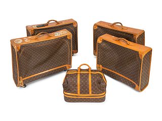 Five Louis Vuitton Suitcases
Dimensions: Garment bags: 24 x 28 x 8 inches weekend bag: 12 x 20 x 17 inches.